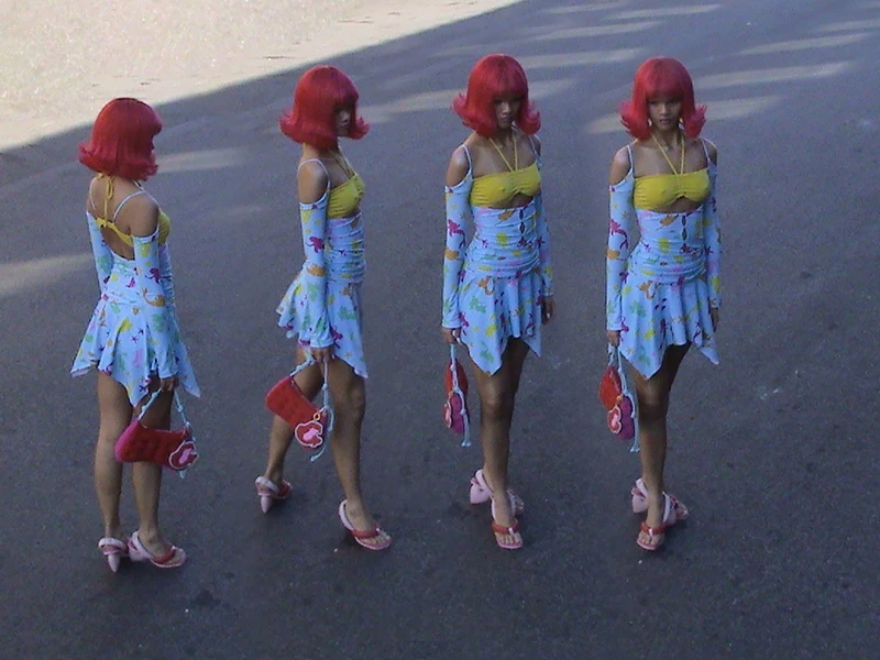 Four campaign views of the yellow and blue Little Mermaid dress