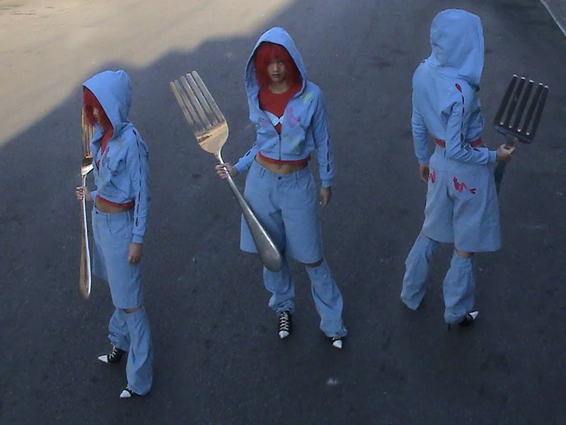 Three campaign views of the blue Little Mermaid hoodie look