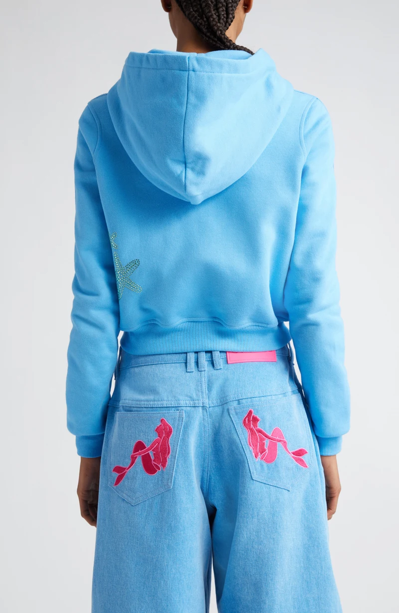 Model wearing the blue Little Mermaid zip hoodie, back view.
