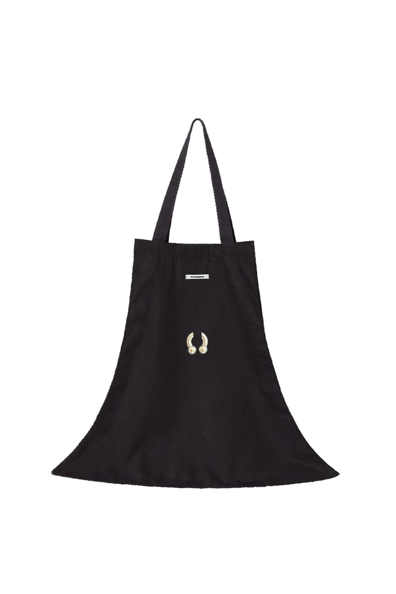 Black flared tote bag proposal with a gold hardware detail