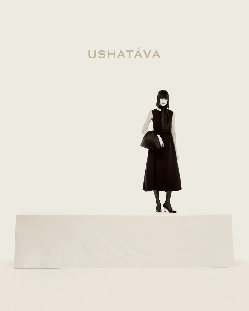 Old But Gold campaign with a black bow bag worn at the wrist