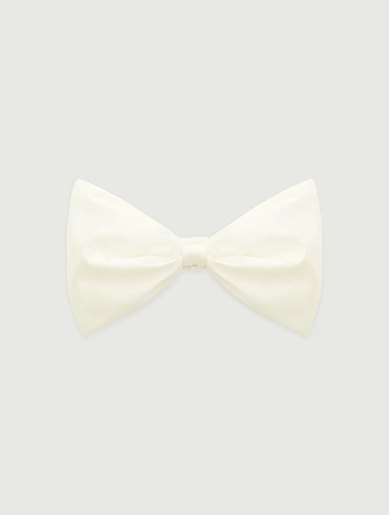 Ivory bow wrist bag