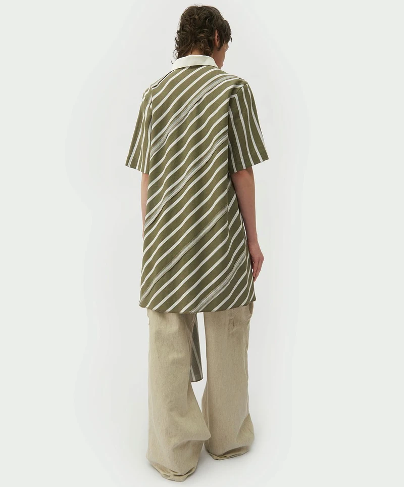 Striped spiral-cut shirt with cream trousers, rear view