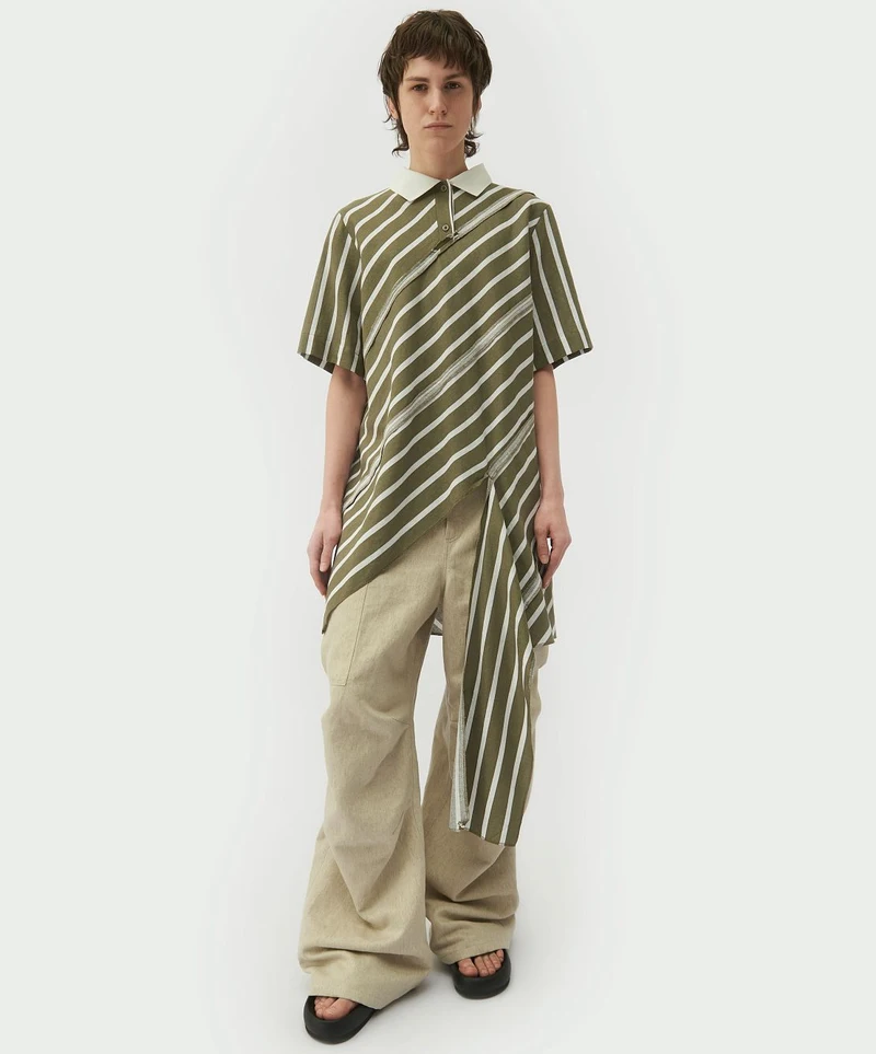 Striped spiral-cut shirt with cream trousers, front view
